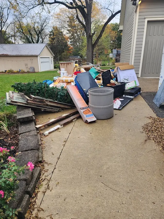 Dumpster being loaded with debris for Residential Dumpster Rental in Minden